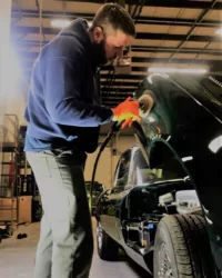 Adam working with a polisher